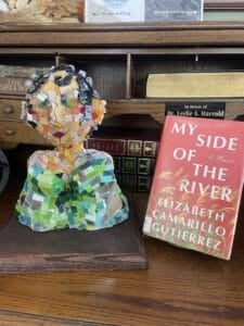 Winning art sculpture next to book.