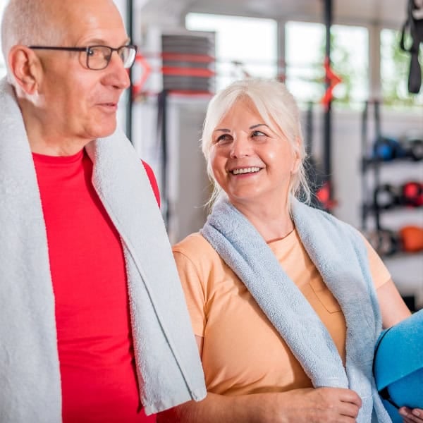 A senior couple at the gym