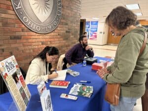 Elizabeth at the signing table