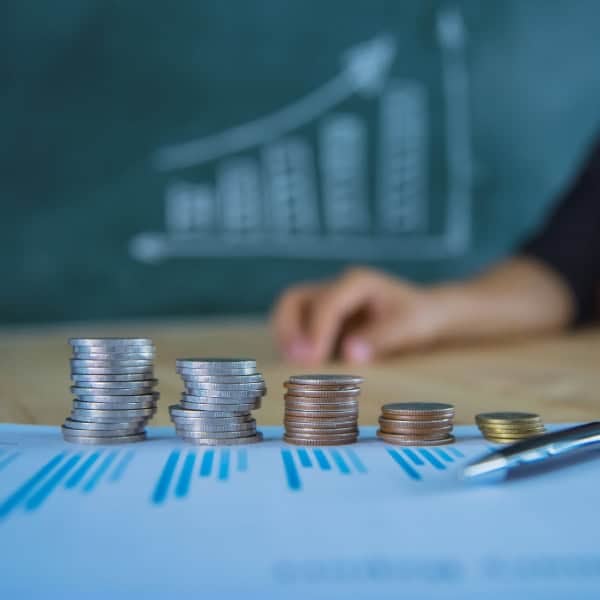Financial chart and coin stacks