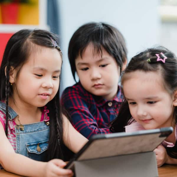 School children using a tablet